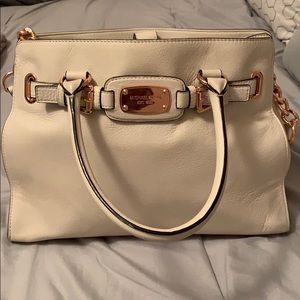 Michael Kors white purse with rose gold accents